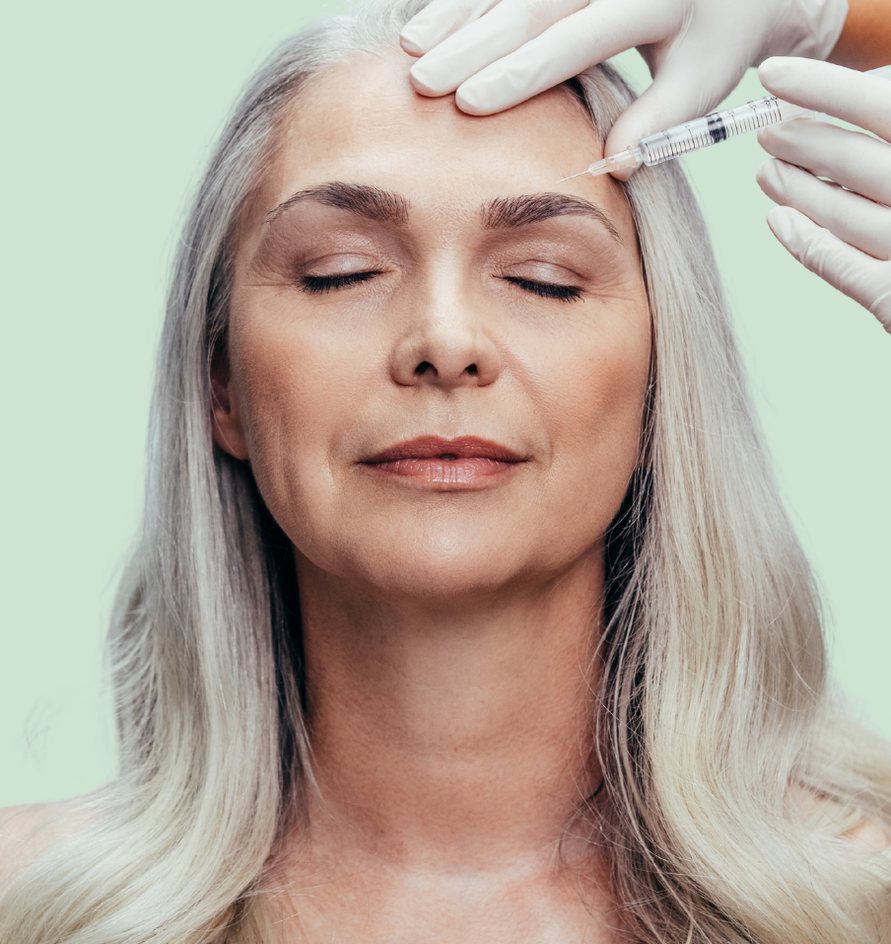 Mature woman receiving a forehead Botox treatment
